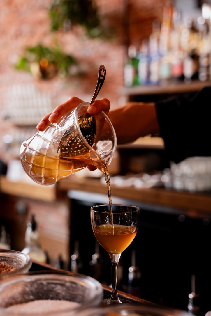 Ryan pouring a cocktail