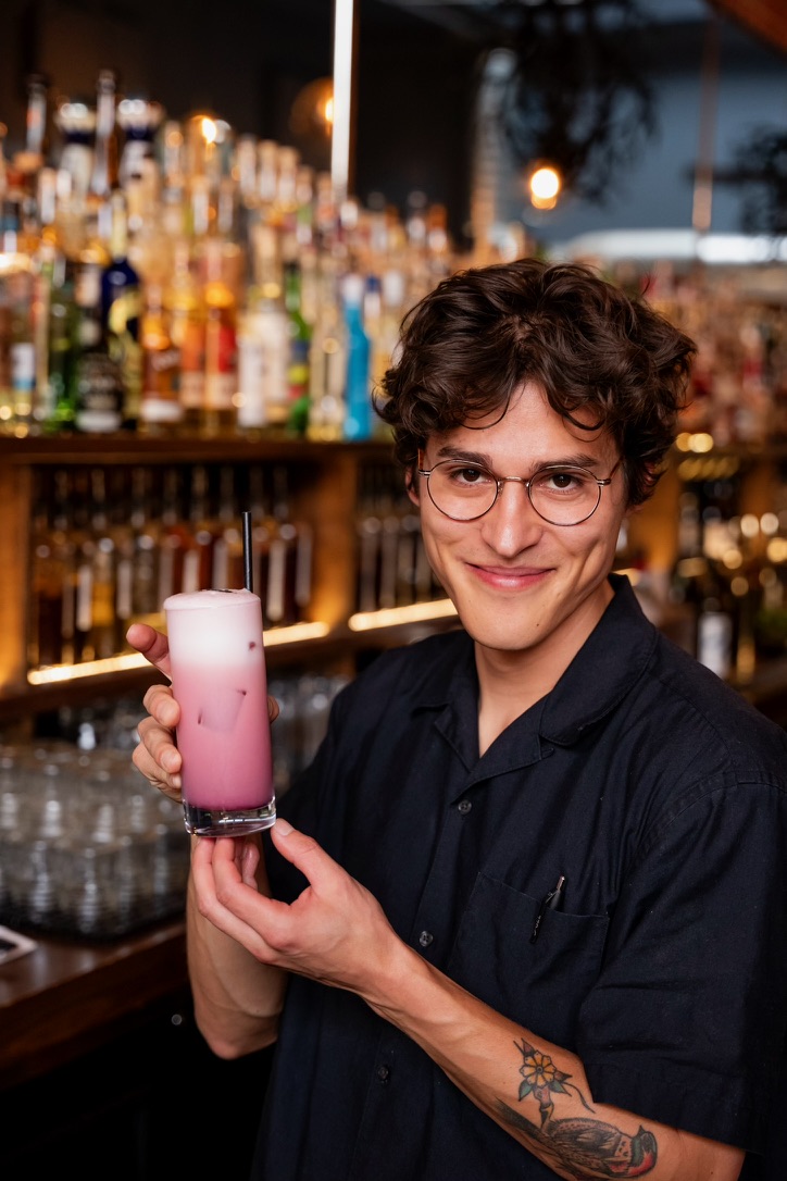 Ryan holding a finished cocktail